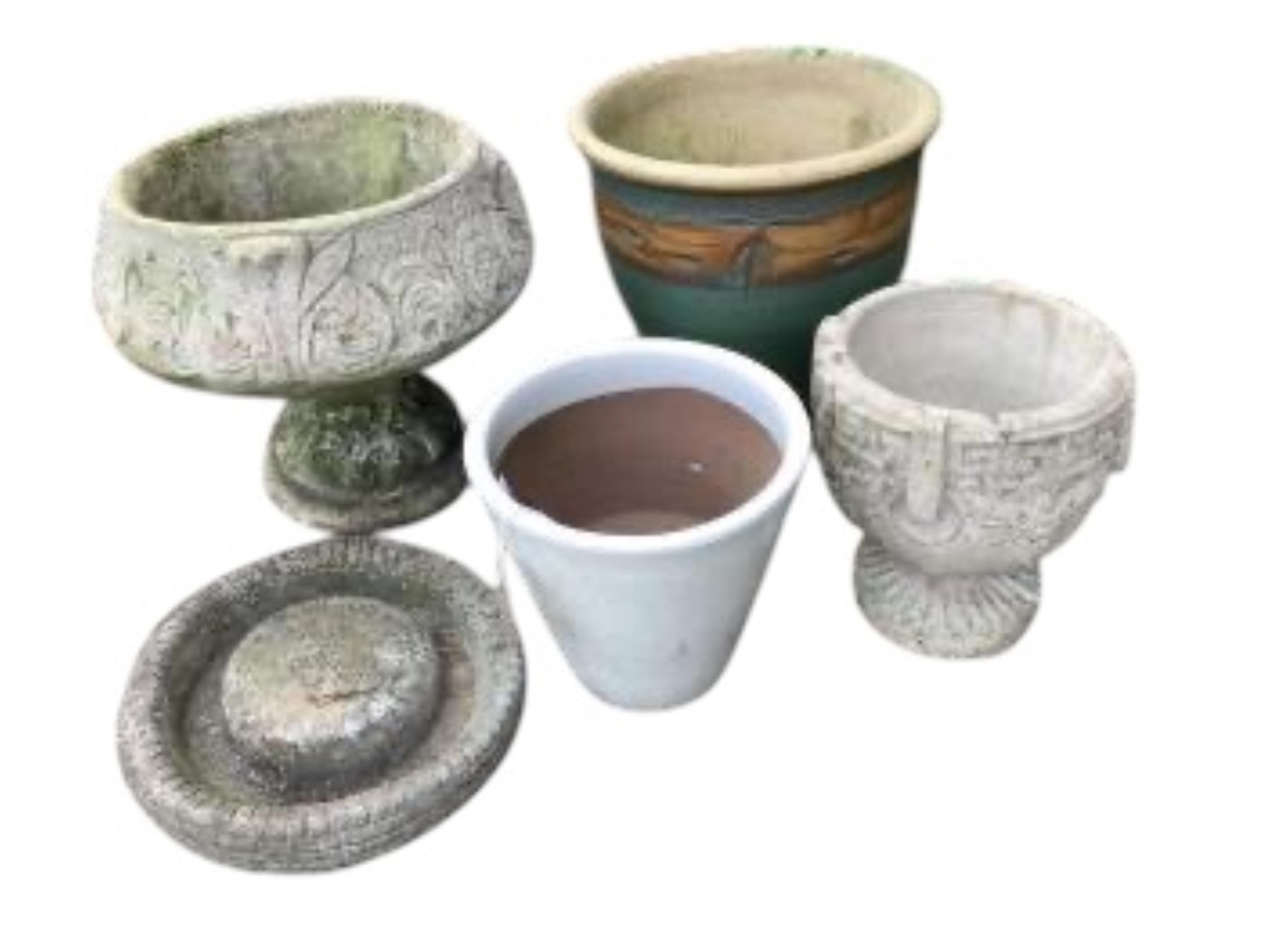 Six assorted stone and earthenware garden planters and a bird bath, largest diameter 38cm, height 32cm